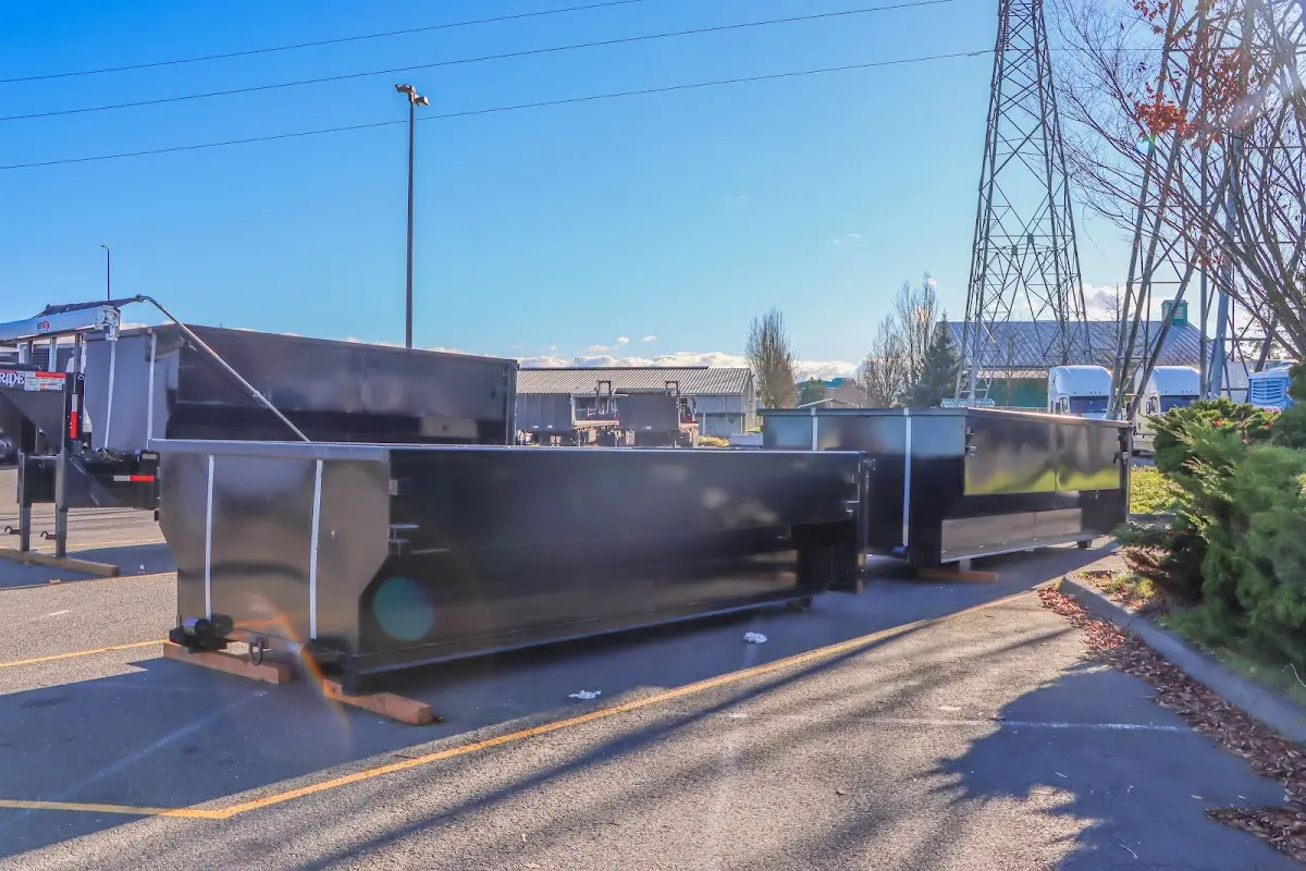 Roll-off dumpster ready for waste disposal at job site for Demolition Dumpster Rental in Butner